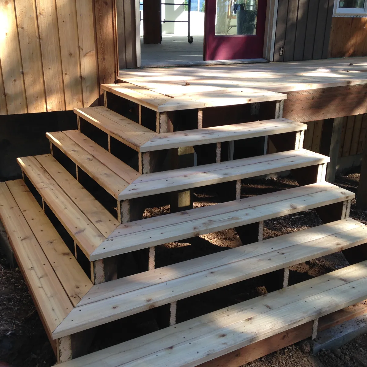 Deep cedar stairs built down from a deck