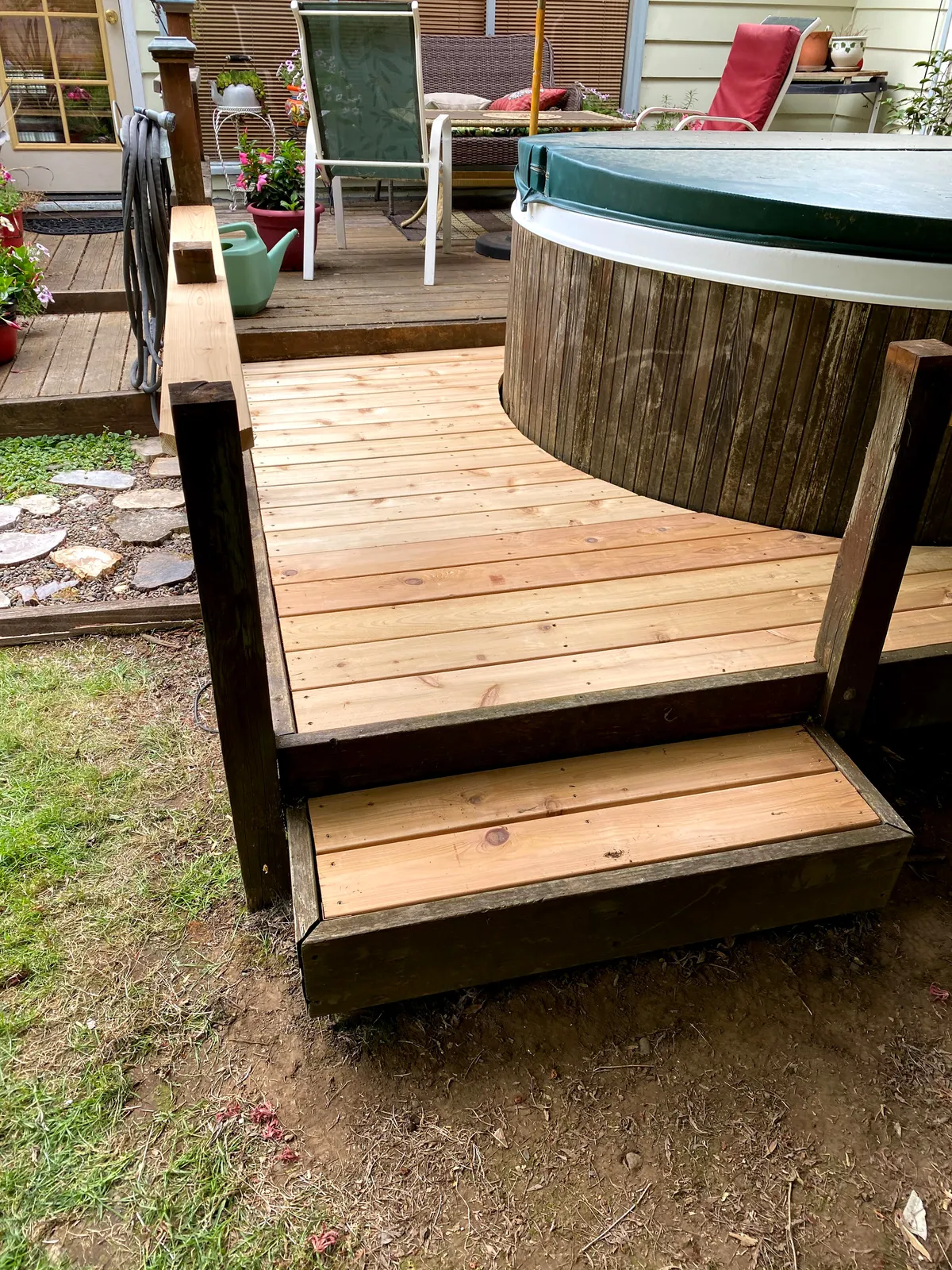Cedar steps and decking built around a hot tub