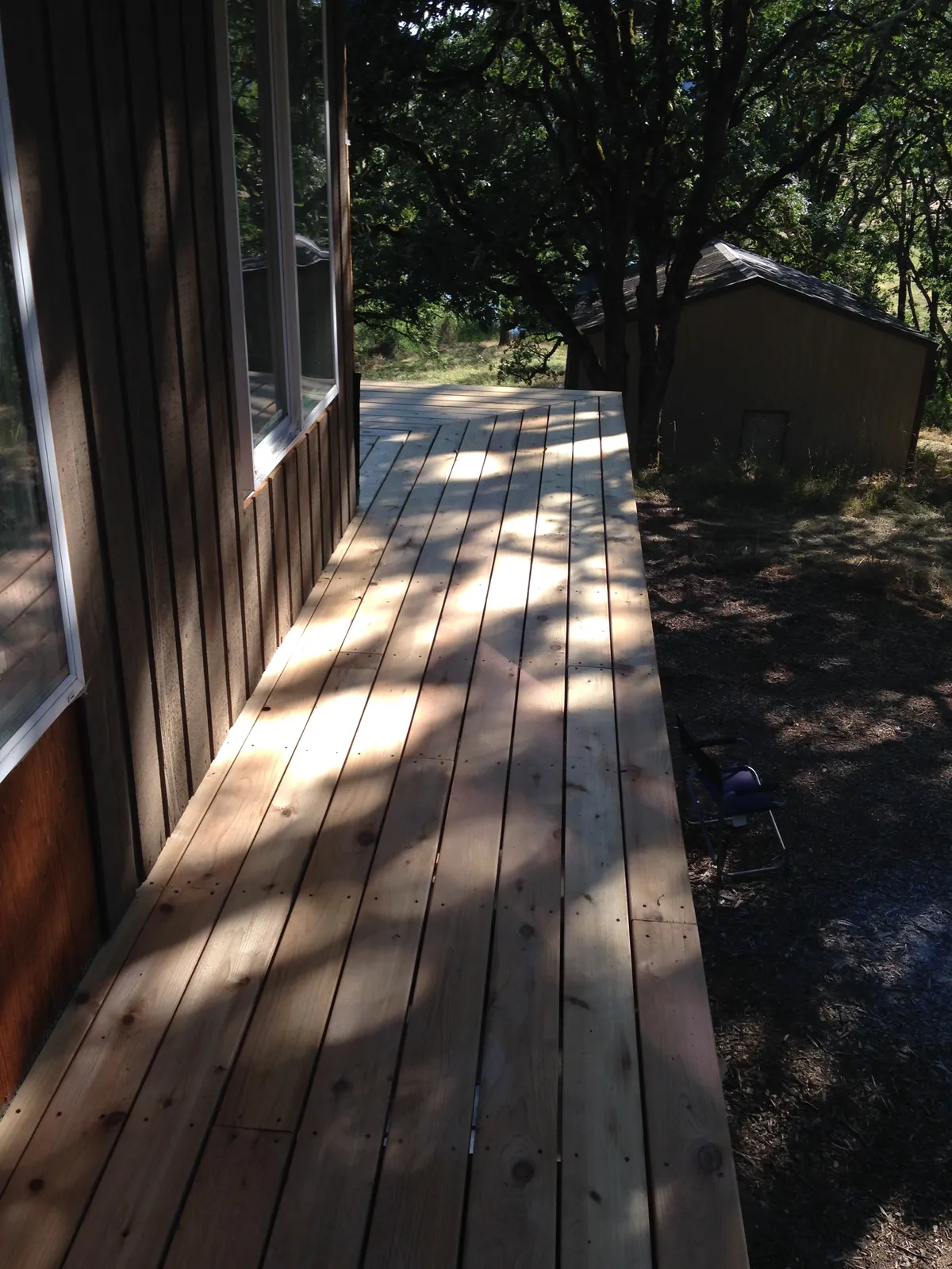 A new cedar walkway along the side of a house