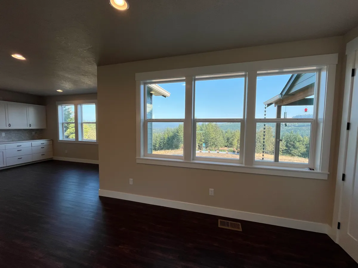 The new craft room: white custom cabinetry, a work desk and new flooring