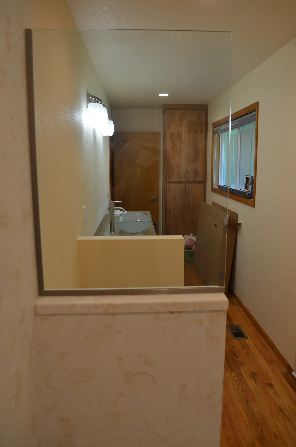 The new primary ensuite: tiled shower, granite vanity and vessel sink
