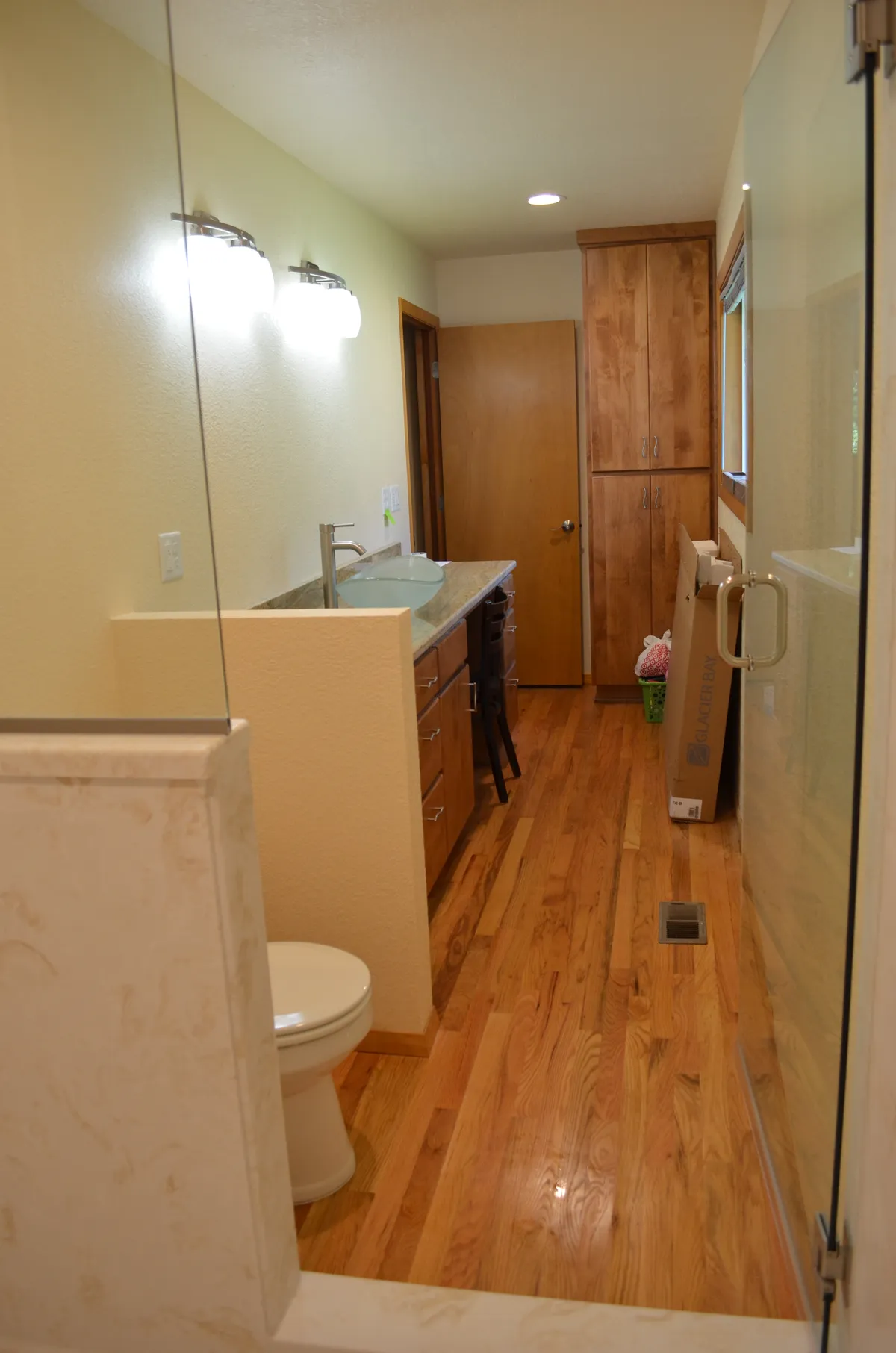 The new primary ensuite: tiled shower, granite vanity and vessel sink