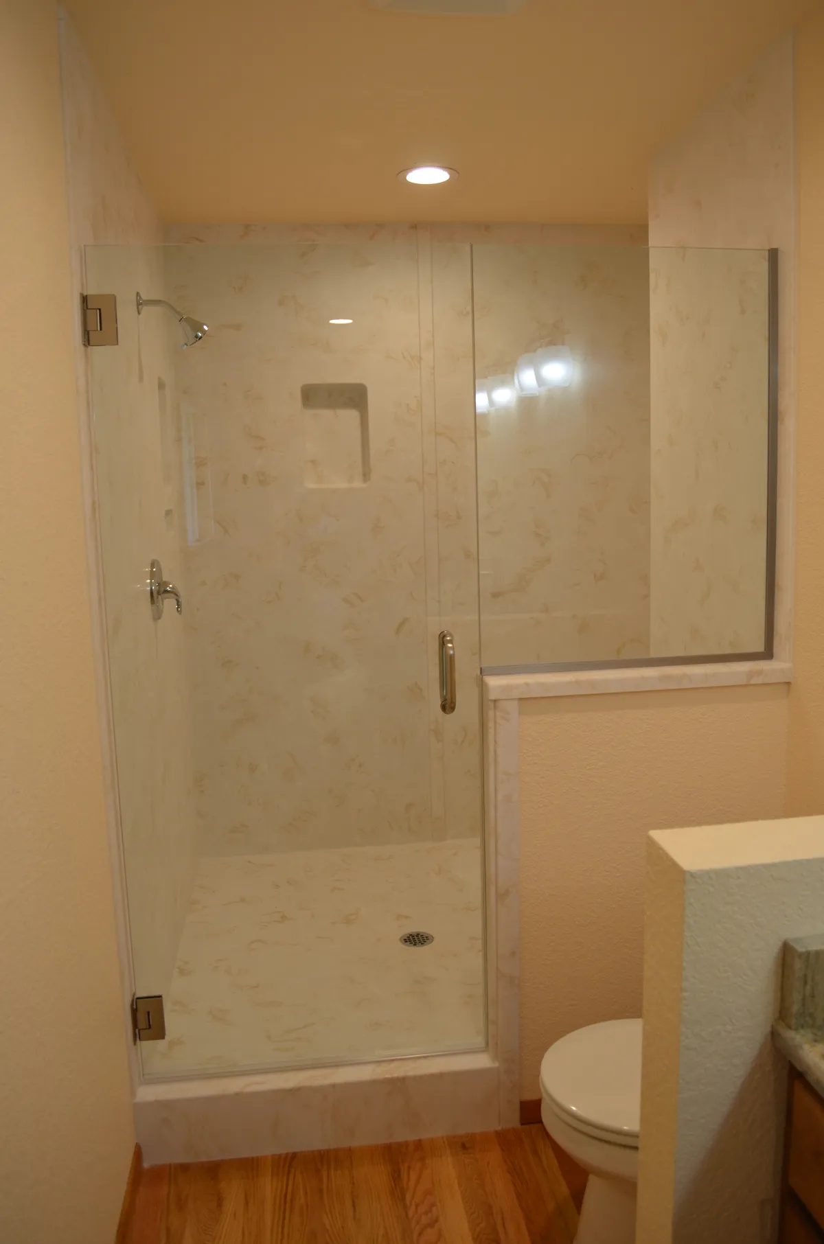 The new primary ensuite: tiled shower, granite vanity and vessel sink