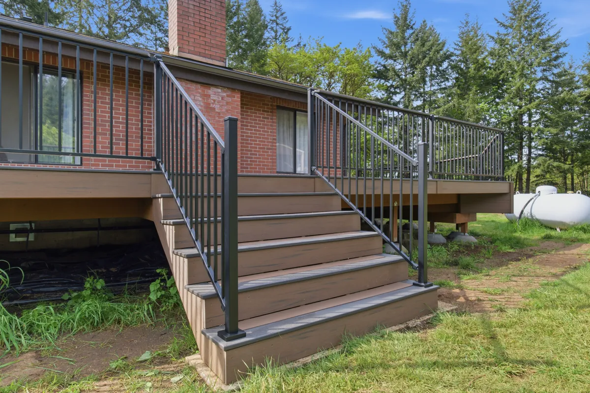 Deck stairs with black aluminum railing
