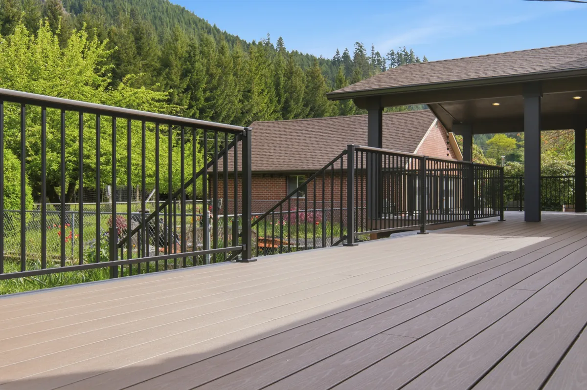Deck stairs with black aluminum railing