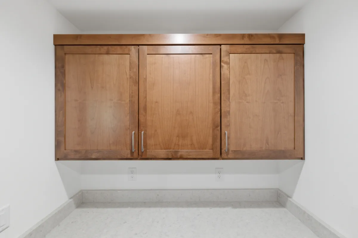 Laundry and work counter with alder upper cabinets