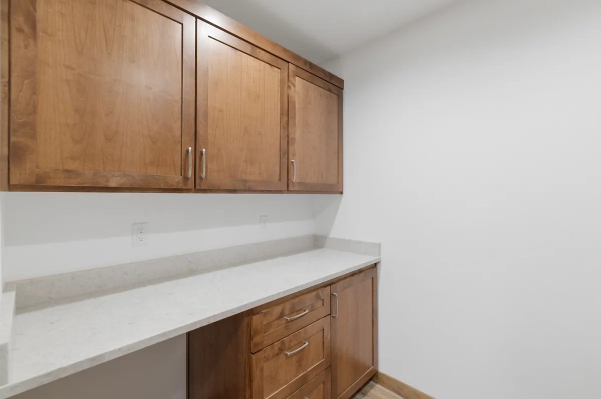 Laundry and work counter with alder upper cabinets